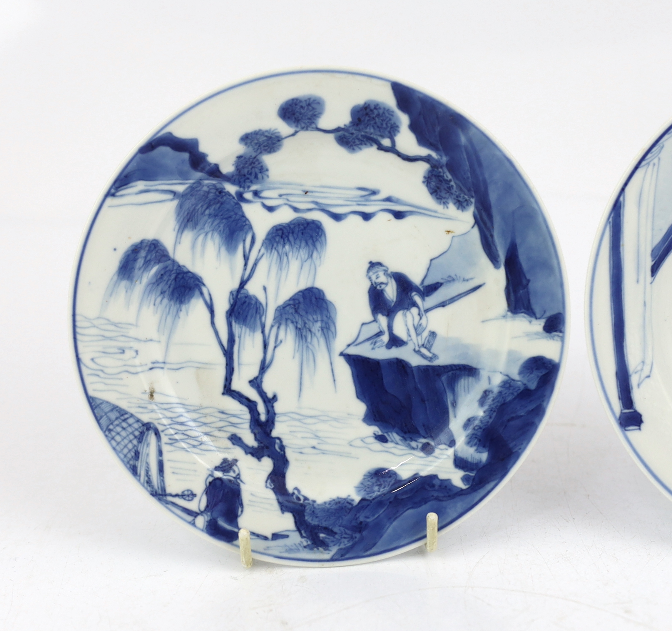 A pair of Chinese blue and white small plates, Kangxi period, hairline cracks to one plate.